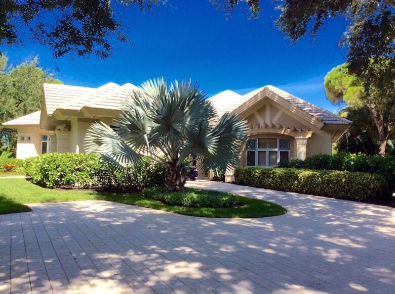 Bonita Bay Estate Home with glass walled dining room overlooking 10,000 gallon pond. - Bonita Springs, Florida
