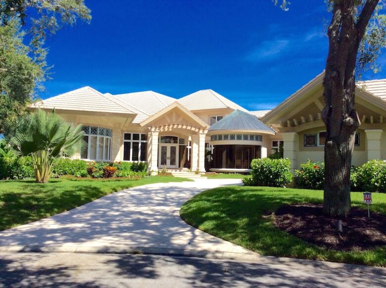 Bonita Bay Estate Home with glass walled dining room overlooking 10,000 gallon pond. - Bonita Springs, Florida