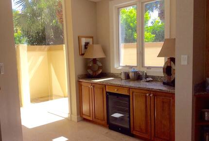 Bonita Bay Estate Home with glass walled dining room overlooking 10,000 gallon pond. - Bonita Springs, Florida