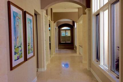 Bonita Bay Estate Home with glass walled dining room overlooking 10,000 gallon pond. - Bonita Springs, Florida