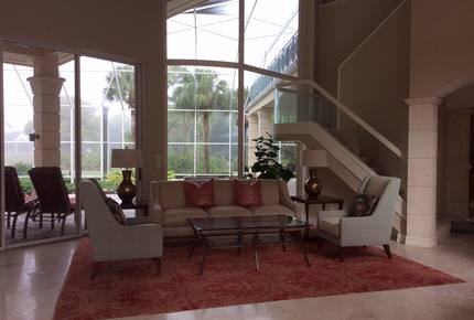 Bonita Bay Estate Home with glass walled dining room overlooking 10,000 gallon pond. - Bonita Springs, Florida