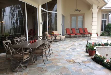 Bonita Bay Estate Home with glass walled dining room overlooking 10,000 gallon pond. - Bonita Springs, Florida