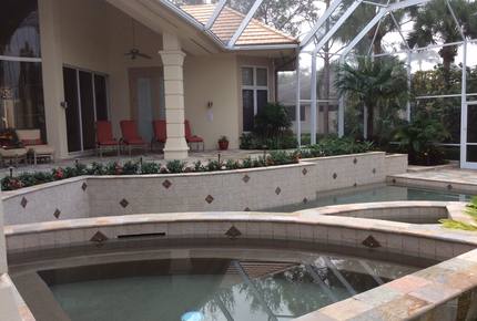 Bonita Bay Estate Home with glass walled dining room overlooking 10,000 gallon pond. - Bonita Springs, Florida