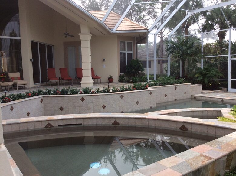 Bonita Bay Estate Home with glass walled dining room overlooking 10,000 gallon pond. - Bonita Springs, Florida