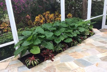 Bonita Bay Estate Home with glass walled dining room overlooking 10,000 gallon pond. - Bonita Springs, Florida