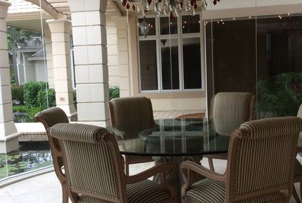 Bonita Bay Estate Home with glass walled dining room overlooking 10,000 gallon pond. - Bonita Springs, Florida