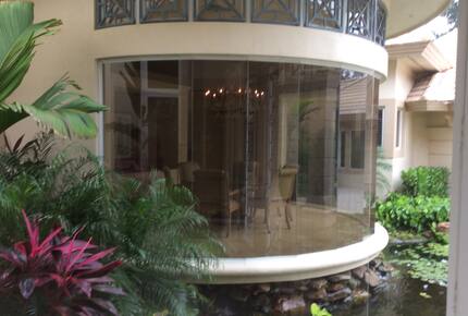 Bonita Bay Estate Home with glass walled dining room overlooking 10,000 gallon pond. - Bonita Springs, Florida