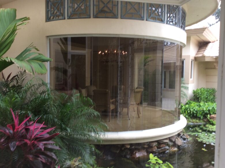 Bonita Bay Estate Home with glass walled dining room overlooking 10,000 gallon pond. - Bonita Springs, Florida