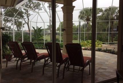 Bonita Bay Estate Home with glass walled dining room overlooking 10,000 gallon pond. - Bonita Springs, Florida