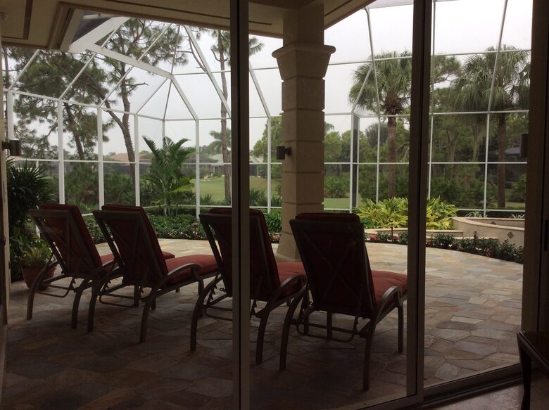 Bonita Bay Estate Home with glass walled dining room overlooking 10,000 gallon pond. - Bonita Springs, Florida