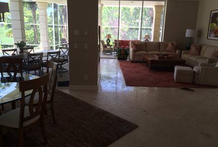 Bonita Bay Estate Home with glass walled dining room overlooking 10,000 gallon pond. - Bonita Springs, Florida