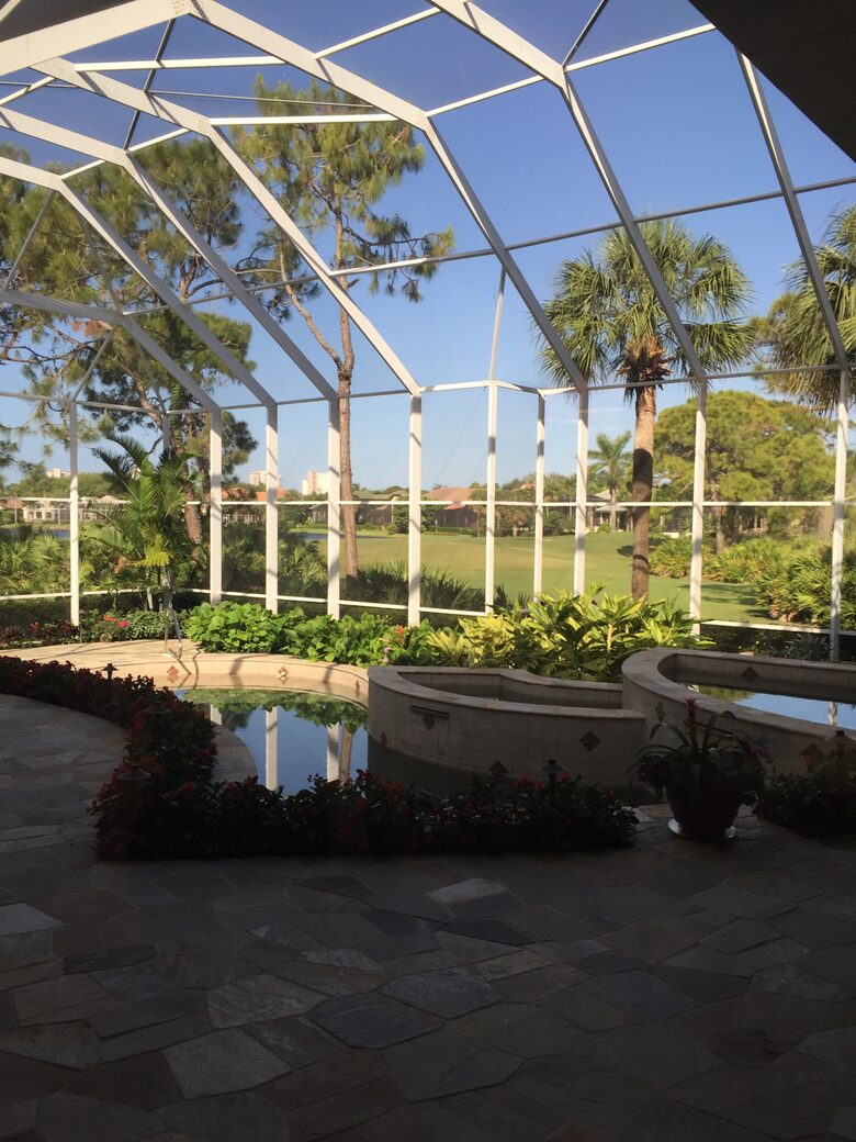 Bonita Bay Estate Home with glass walled dining room overlooking 10,000 gallon pond. - Bonita Springs, Florida