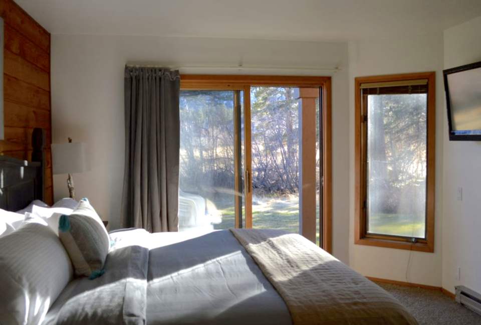 another view of bedroom with sliders to creek- bedroom # 1