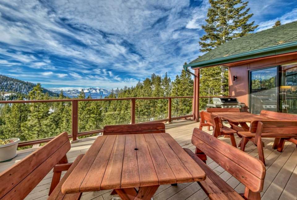 Seating on top floor deck complete with lake/mountain views.