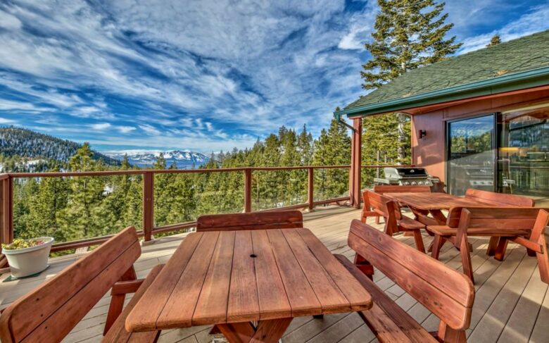 Seating on top floor deck complete with lake/mountain views.