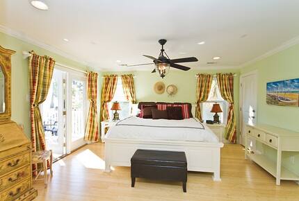 Home Exchange in Tybee Island, GA master bedroom with patio