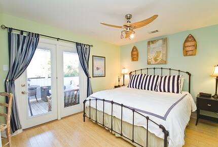 Home Exchange in Tybee Island, GA large bedroom with patio