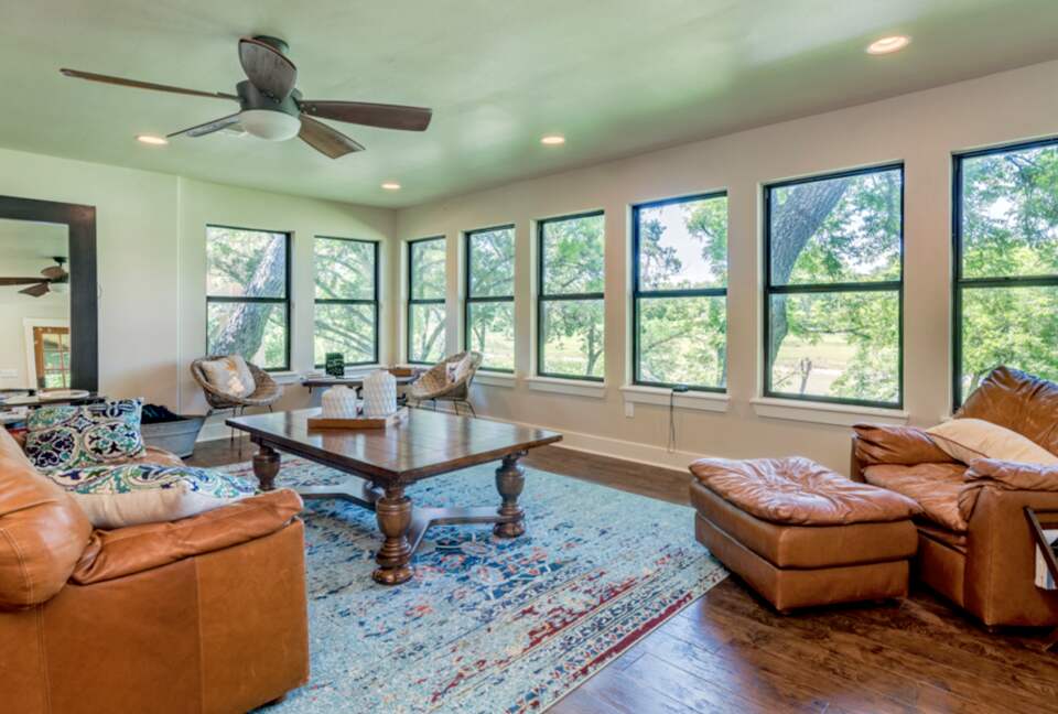 Open living room with view of the Blanco River