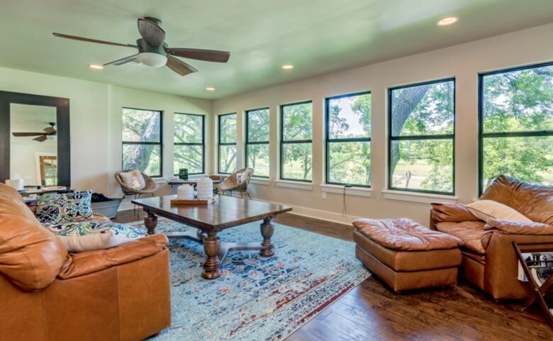 Open living room with view of the Blanco River