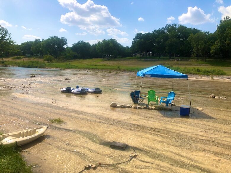 The water is more shallow right in front of the house