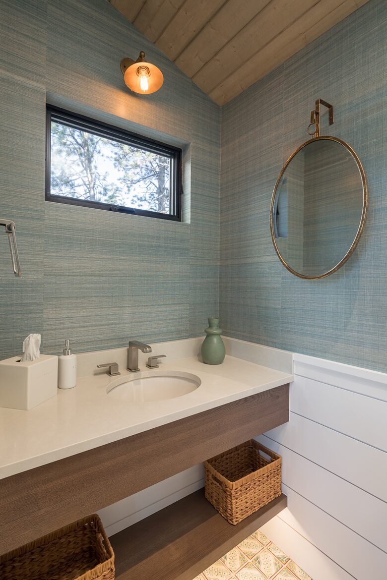 Main floor family room bathroom sink with window above.
