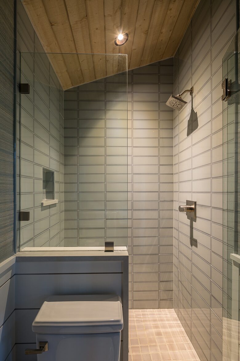 Main floor family room glass-enclosed walk-in shower.