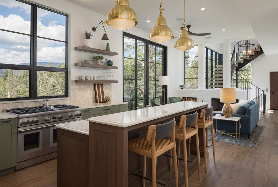 Kitchen island and family room with 10' sliding glass door.