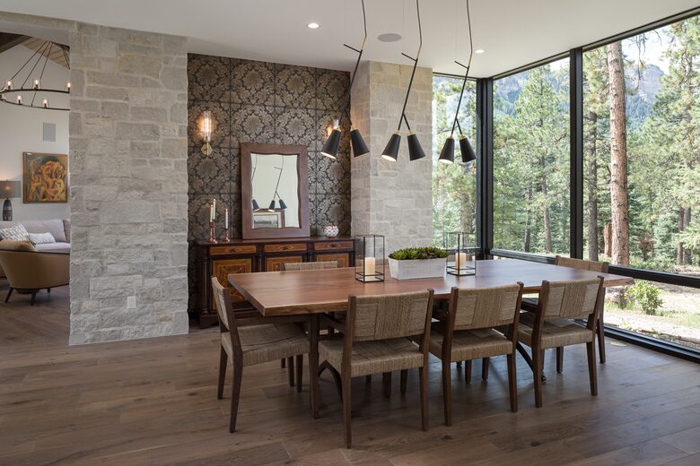 Dining room with table & 8 chairs & floor to ceiling windows