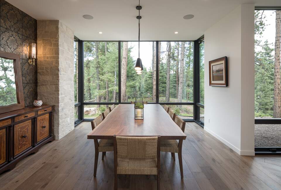 View from the head of the dining room table facing windows