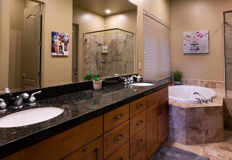 Master bath with granite counter dual vanity & soaking tub