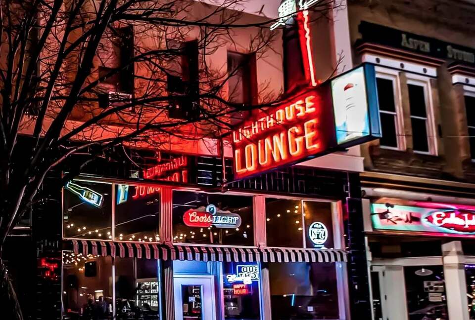 Lighthouse Lounge neon sign and storefront