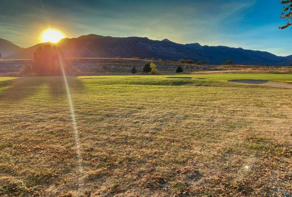 Acres of land in Eden, Utah at sunset