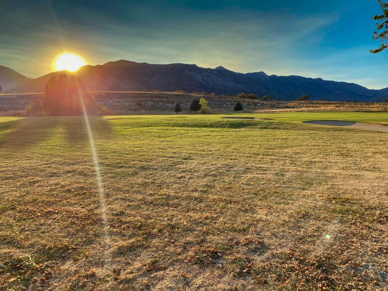 Acres of land in Eden, Utah at sunset