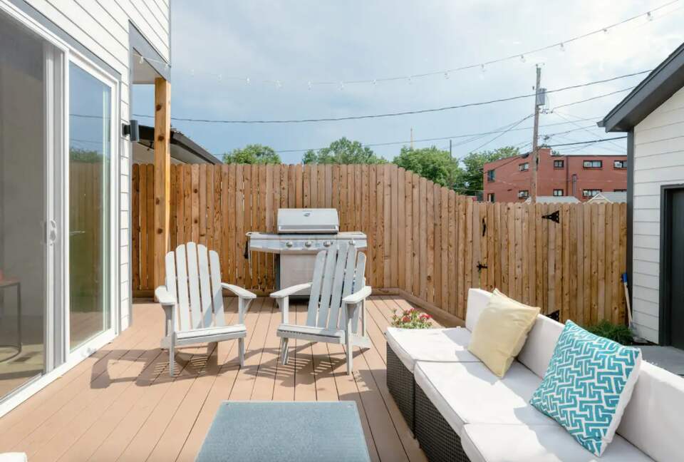 Outdoor deck with patio furniture and grill
