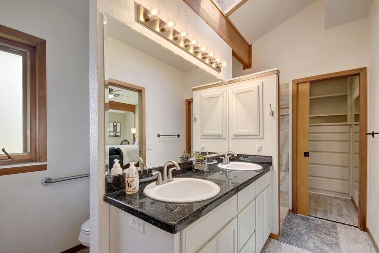 Downstairs master bath with dual vanity granite countertop