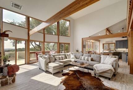 Lodge great room with vaulted ceilings and large windows