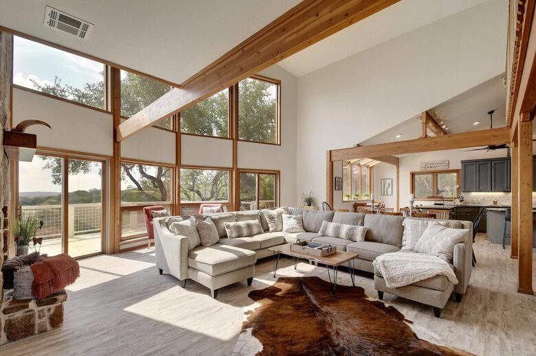 Lodge great room with vaulted ceilings and large windows