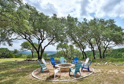Fire pit with 9 Adirondack chairs overlooking Hill Country