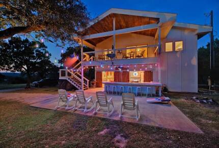 Exterior view of Retreat outdoor bar area at night