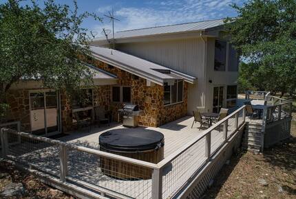 The Lodge deck with round hot tub