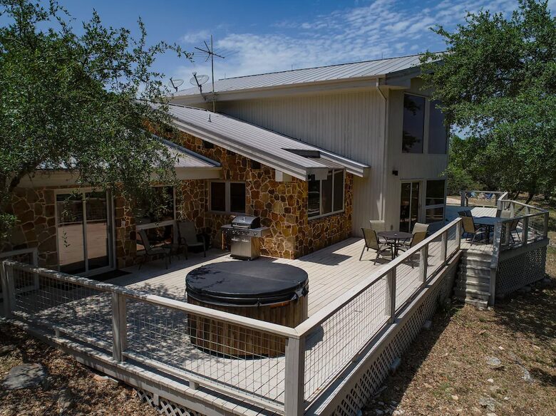 The Lodge deck with round hot tub