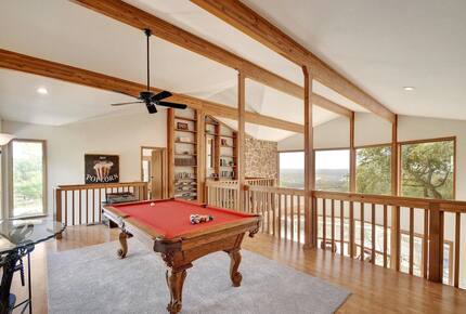 Lodge upstairs loft with red pool table