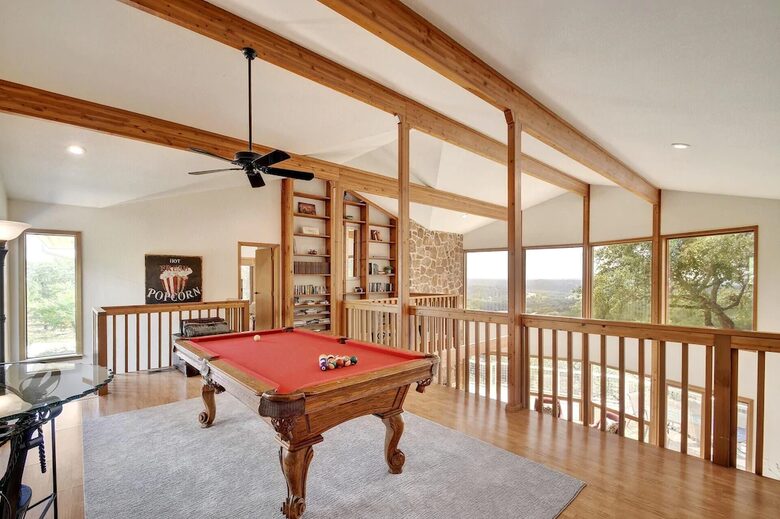 Lodge upstairs loft with red pool table