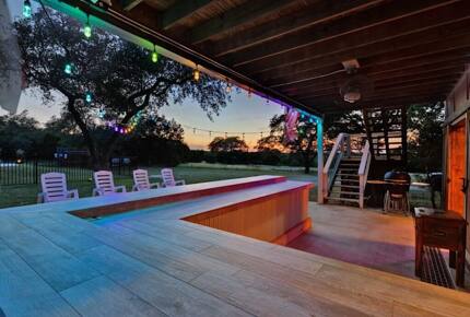 Outdoor bar at night at the Retreat & charcoal grill/smoker