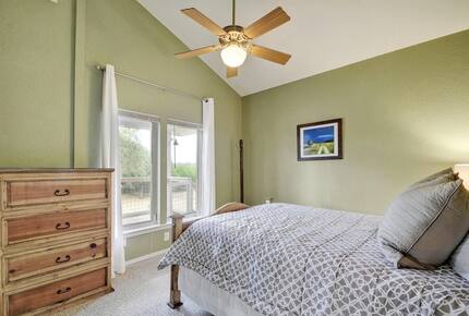 Retreat guest room with queen bed and light green walls