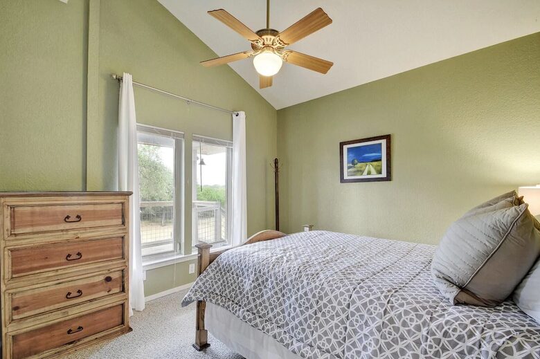 Retreat guest room with queen bed and light green walls