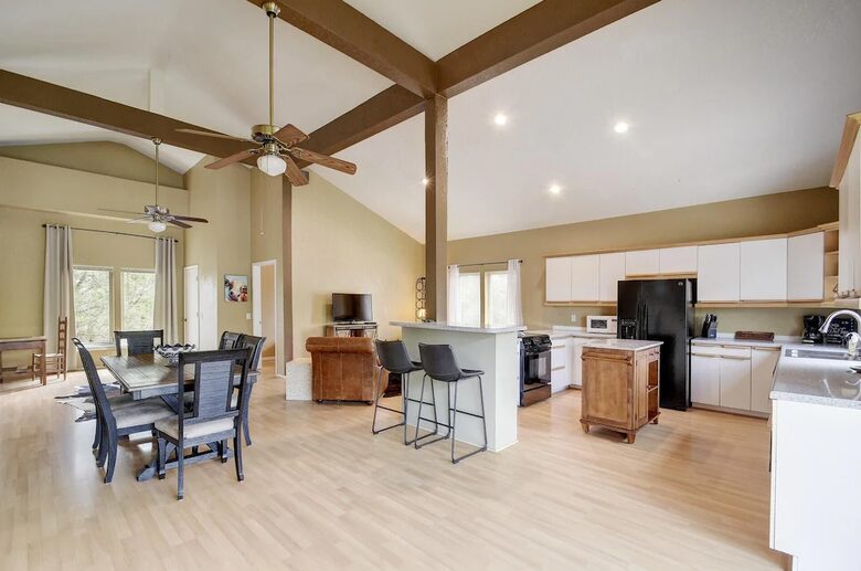 Retreat living area with dining table and chef's kitchen