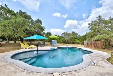 Inground pool with with built-in steps & blue umbrella