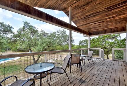 Retreat balcony with tables & chairs overlooking the pool