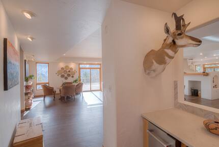 Home exchange in La Veta CO, wet bar leading out toward living room